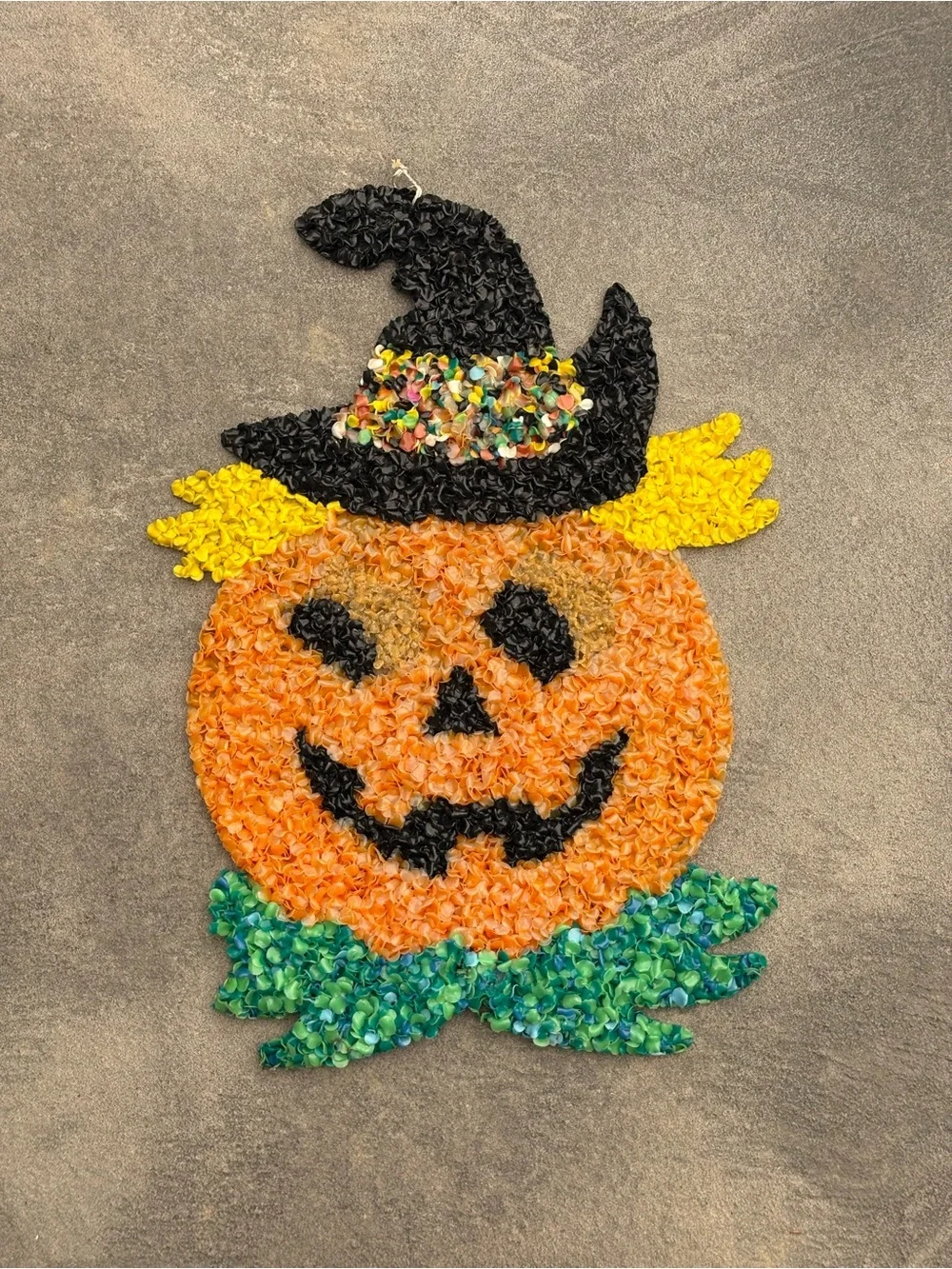 VTG melted plastic popcorn decoration features a jack-o'-lantern wearing a hat